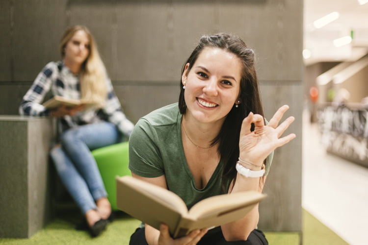 picture shows woman with book