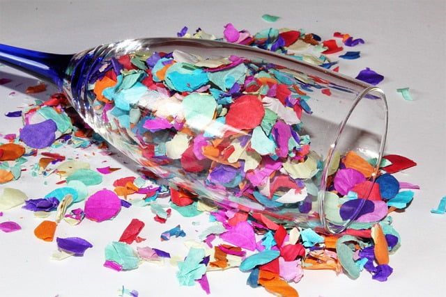 Glass of Confetti on a ground